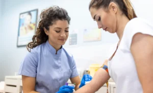 Healthcare professional conducting a medical test for a domestic worker during a routine health screening